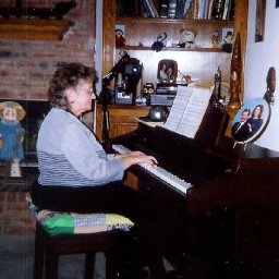 Mom Thedford-Bizzell playing Johnnie\\\'s piano.jpg